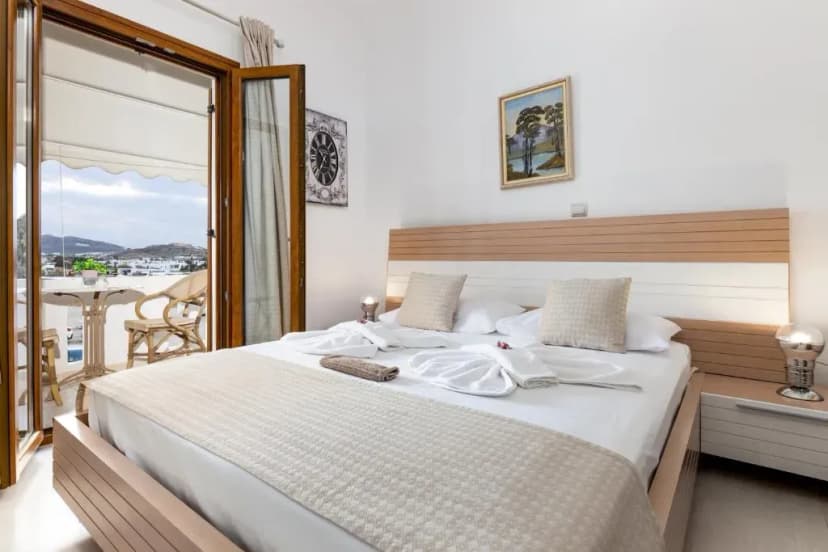 Slaapkamer van Panos Luxury Rooms op Paros