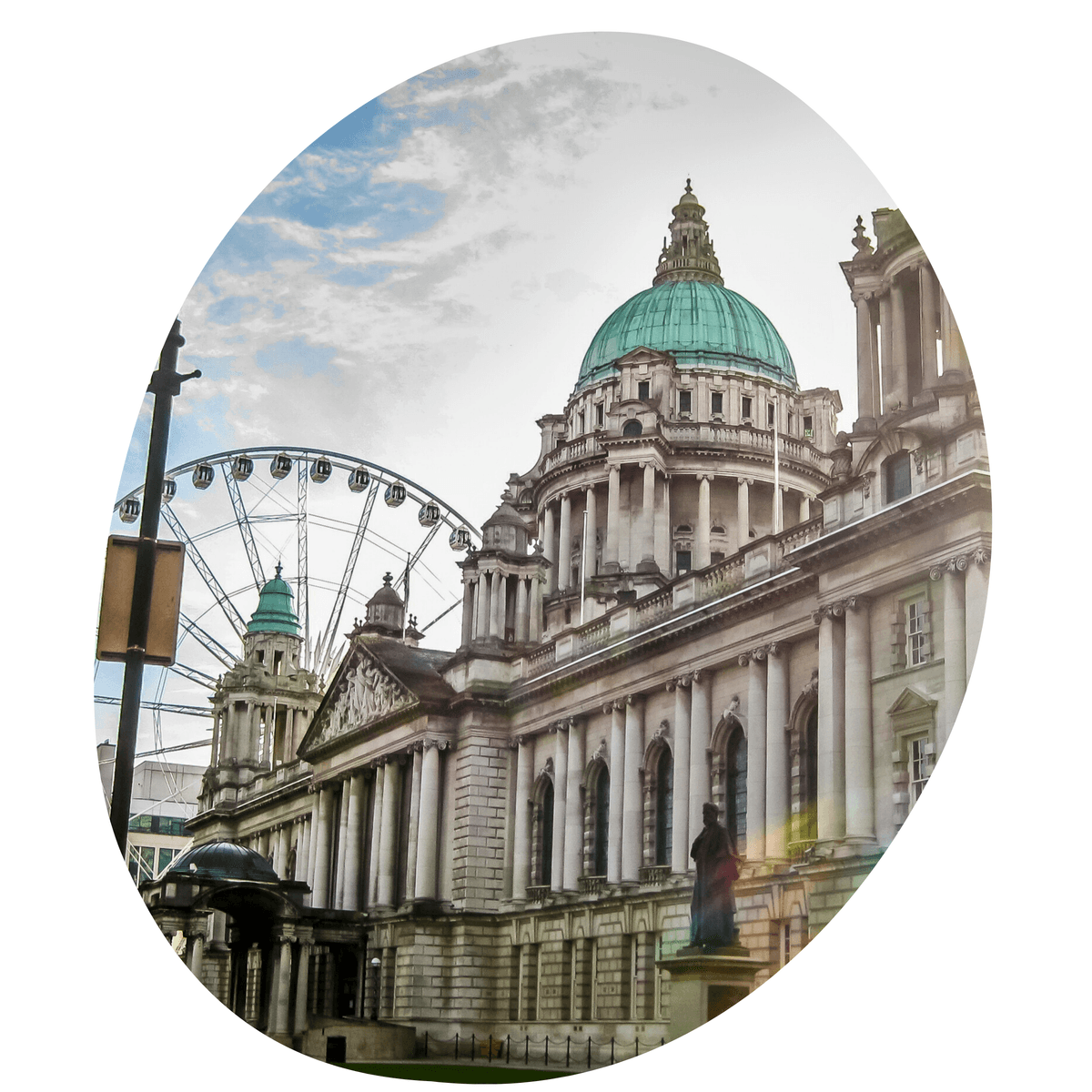 Belfast City Hall in Northern Ireland with sun flare and ferris wheel in the background