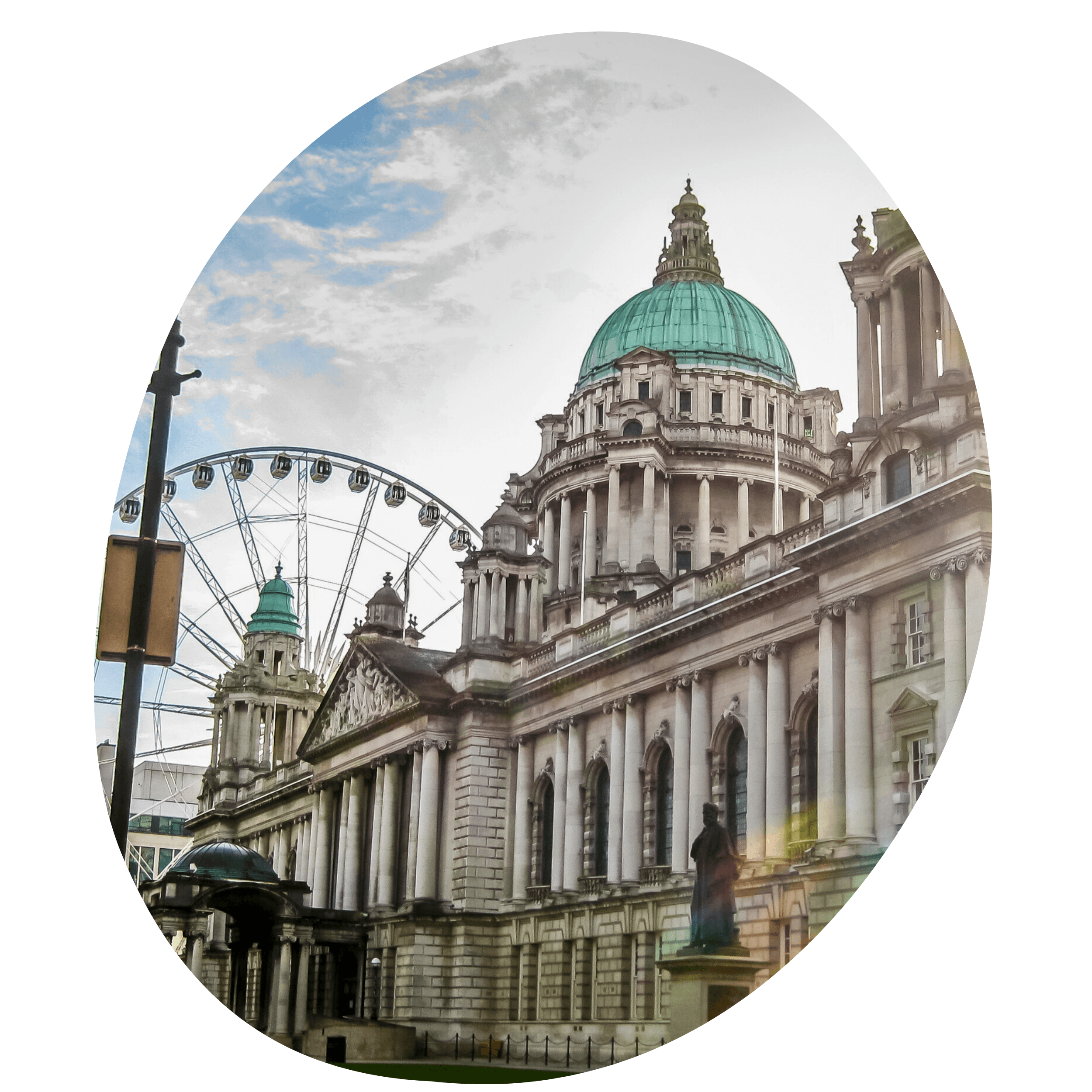 Belfast City Hall in Northern Ireland with sun flare and ferris wheel in the background